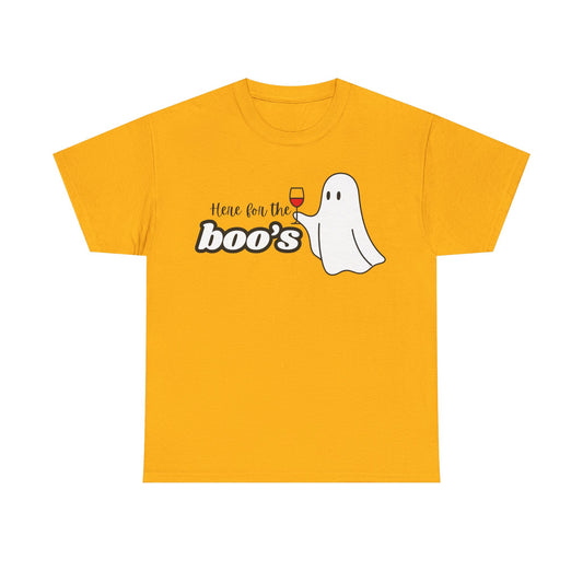 A yellow short-sleeve crewneck t-shirt with a graphic on the chest that reads 'Here for the boo's' next to a cartoon ghost holding a wine glass, shown on a plain white background.