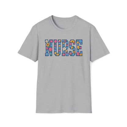 A light gray heather crewneck t-shirt featuring the word 'NURSE' printed across the chest in a colorful floral patterned font, shown against a plain white background.
