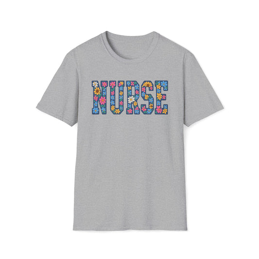 A light gray heather crewneck t-shirt featuring the word 'NURSE' printed across the chest in a colorful floral patterned font, shown against a plain white background.