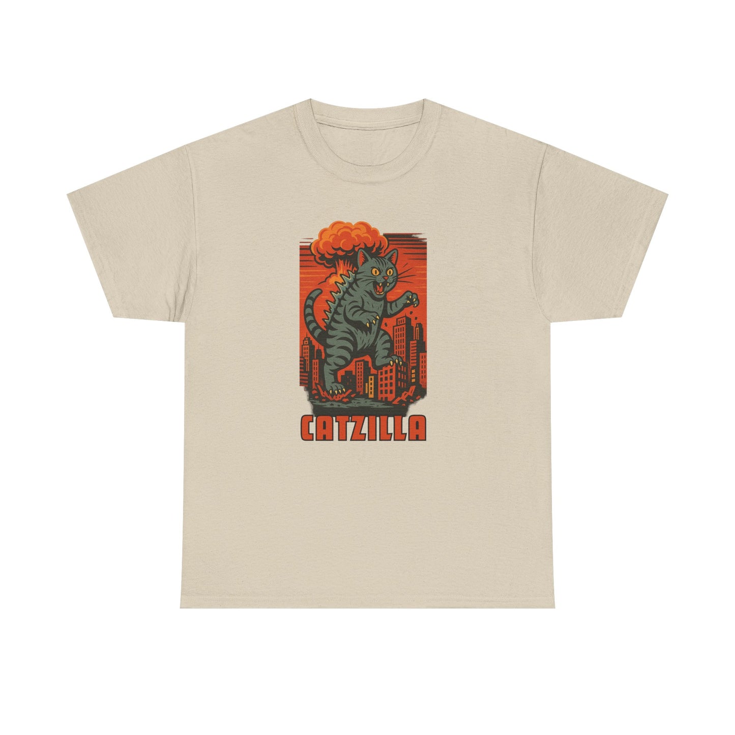 A beige crewneck t-shirt featuring a retro-style graphic of a green cat monster with orange hair standing in front of a red cityscape, with the word 'CATZILLA' printed below.