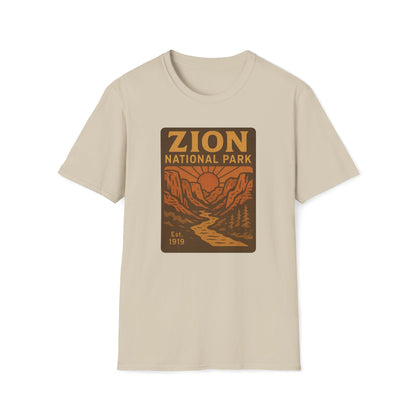A beige crewneck t-shirt featuring a retro-style graphic print of Zion National Park on the chest, displayed against a solid white background.