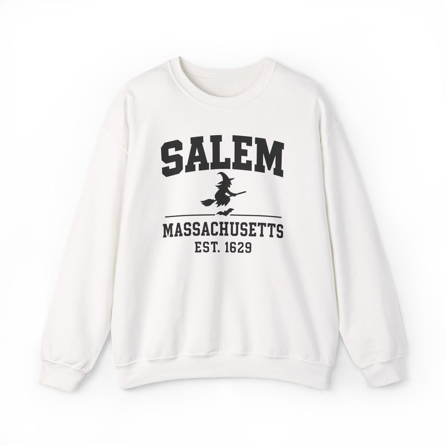 An off-white crewneck sweatshirt featuring a black graphic print on the front that reads 'SALEM MASSACHUSETTS EST. 1629' with a silhouette of a witch riding a broomstick.