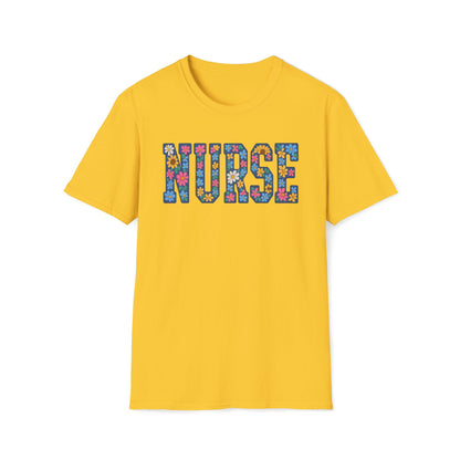 A yellow short-sleeve crewneck t-shirt featuring the word 'NURSE' printed across the chest in colorful, patterned letters filled with small flowers, on a solid white background.