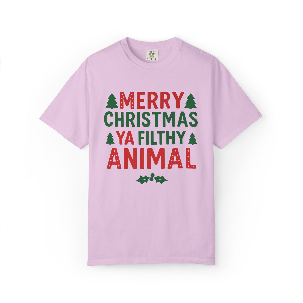 A light pink short-sleeve crewneck t-shirt with a festive graphic on the front that reads 'MERRY CHRISTMAS YA FILTHY ANIMAL' in red and green lettering, accented with small green pine trees and holly leaves, shown on a plain white background.