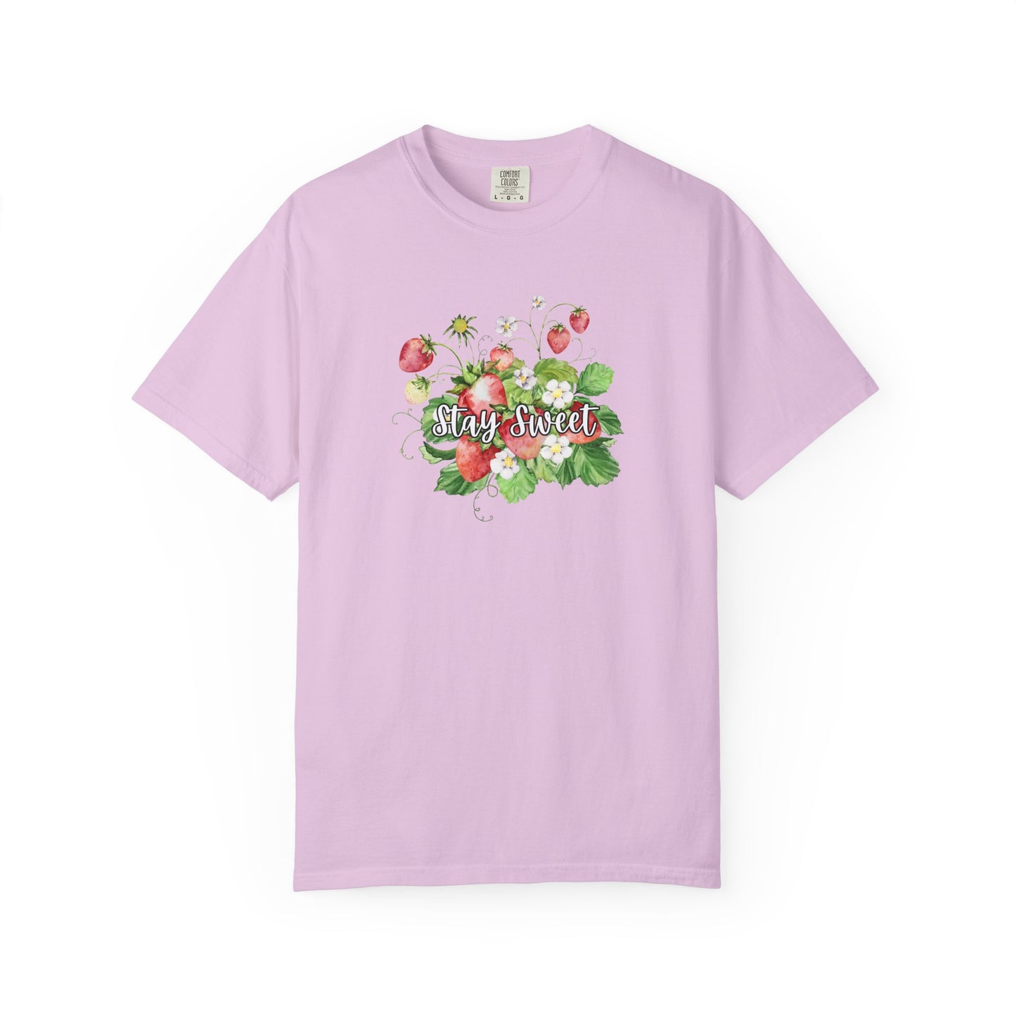 A light purple short-sleeve crewneck t-shirt featuring a colorful graphic of strawberries, green leaves, and the words 'Stay Sweet' in white script across the chest, displayed on a clean white background.