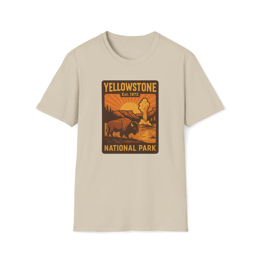 A light beige crewneck t-shirt featuring a retro-style Yellowstone National Park graphic on the chest, displayed against a solid white background.