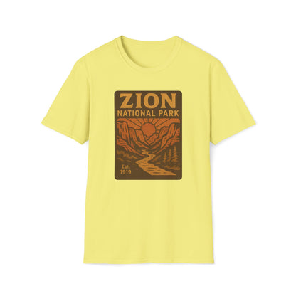 A pale yellow short-sleeve crewneck t-shirt featuring a retro-style 'Zion National Park' graphic on the chest, displayed against a solid white background.