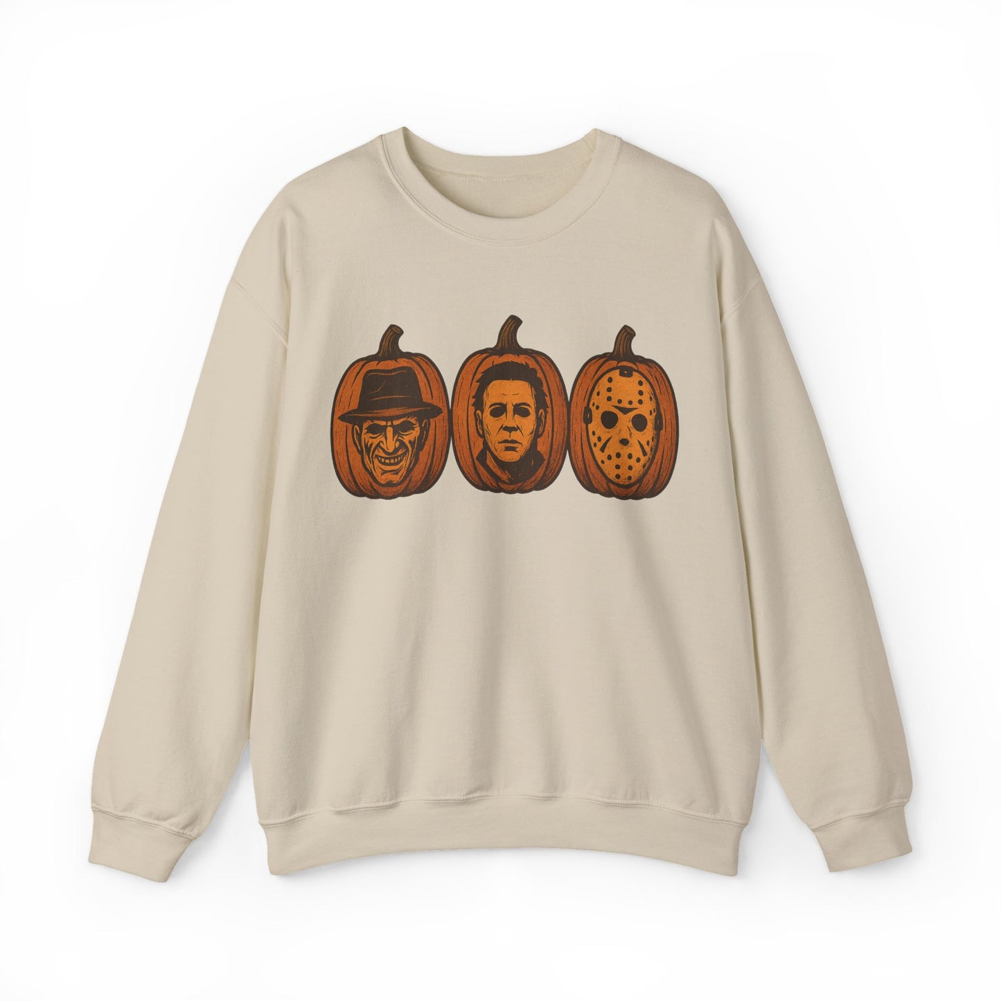 A light beige crewneck sweatshirt featuring a graphic print of three horror movie pumpkin faces on the chest, displayed against a solid white background.