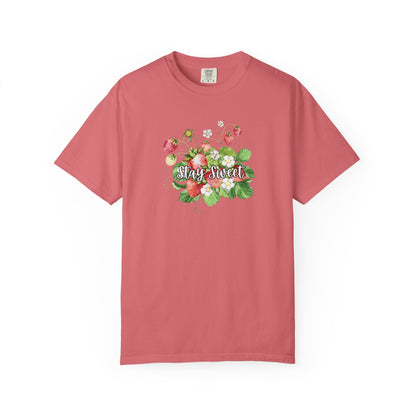 A dusty rose pink short-sleeve t-shirt with a colorful floral graphic on the chest featuring the text 'Stay Sweet' in white script, displayed on a clean white background.