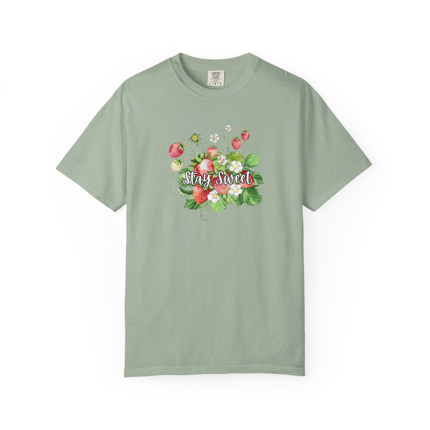A sage green short-sleeve t-shirt with a colorful floral graphic on the chest featuring strawberries, green leaves, and the text 'Stay Sweet' in cursive, displayed on a clean white background.