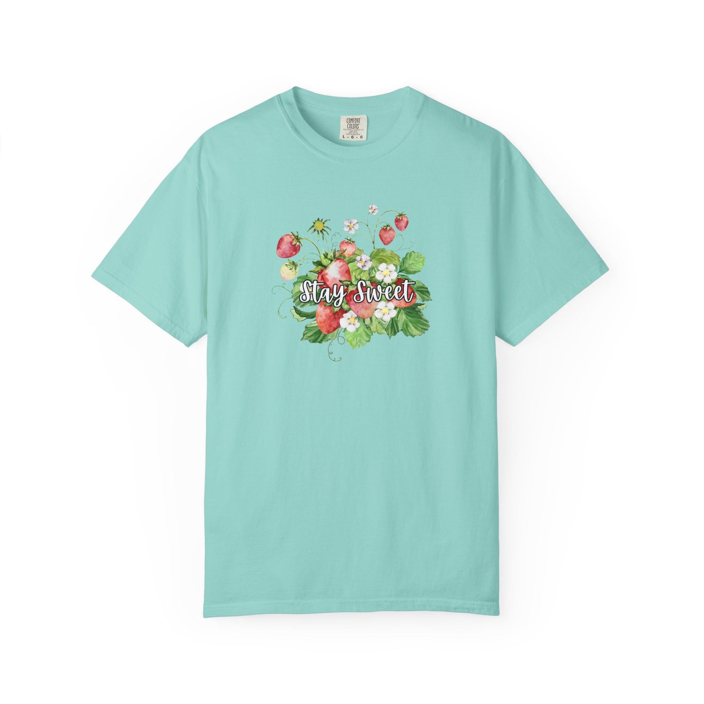 A light turquoise short-sleeve crewneck t-shirt featuring a colorful floral graphic on the chest with strawberries and the text 'Stay Sweet'.