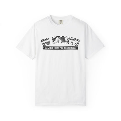 A white short-sleeve crewneck t-shirt with a black graphic print on the chest reading 'GO SPORTS' and 'I'M JUST HERE FOR THE SNACKS'.