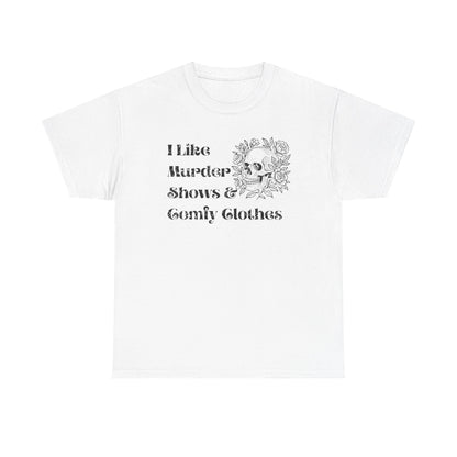 A white short-sleeve crewneck t-shirt with a black graphic print on the front. The graphic features the text 'I Like Murder Shows & Gomf Clothes' alongside a detailed illustration of a skull surrounded by roses.