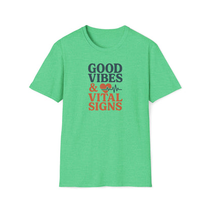 A heather green short-sleeve t-shirt with a graphic on the chest that reads 'GOOD VIBES & VITAL SIGNS' in dark green and orange text, accompanied by a heart and heartbeat line icon, shown on a plain white background.