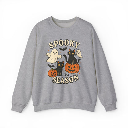 A heather gray crewneck sweatshirt featuring a 'Spooky Season' Halloween graphic with cartoon ghosts, black cats, pumpkins, and bats on a white background.