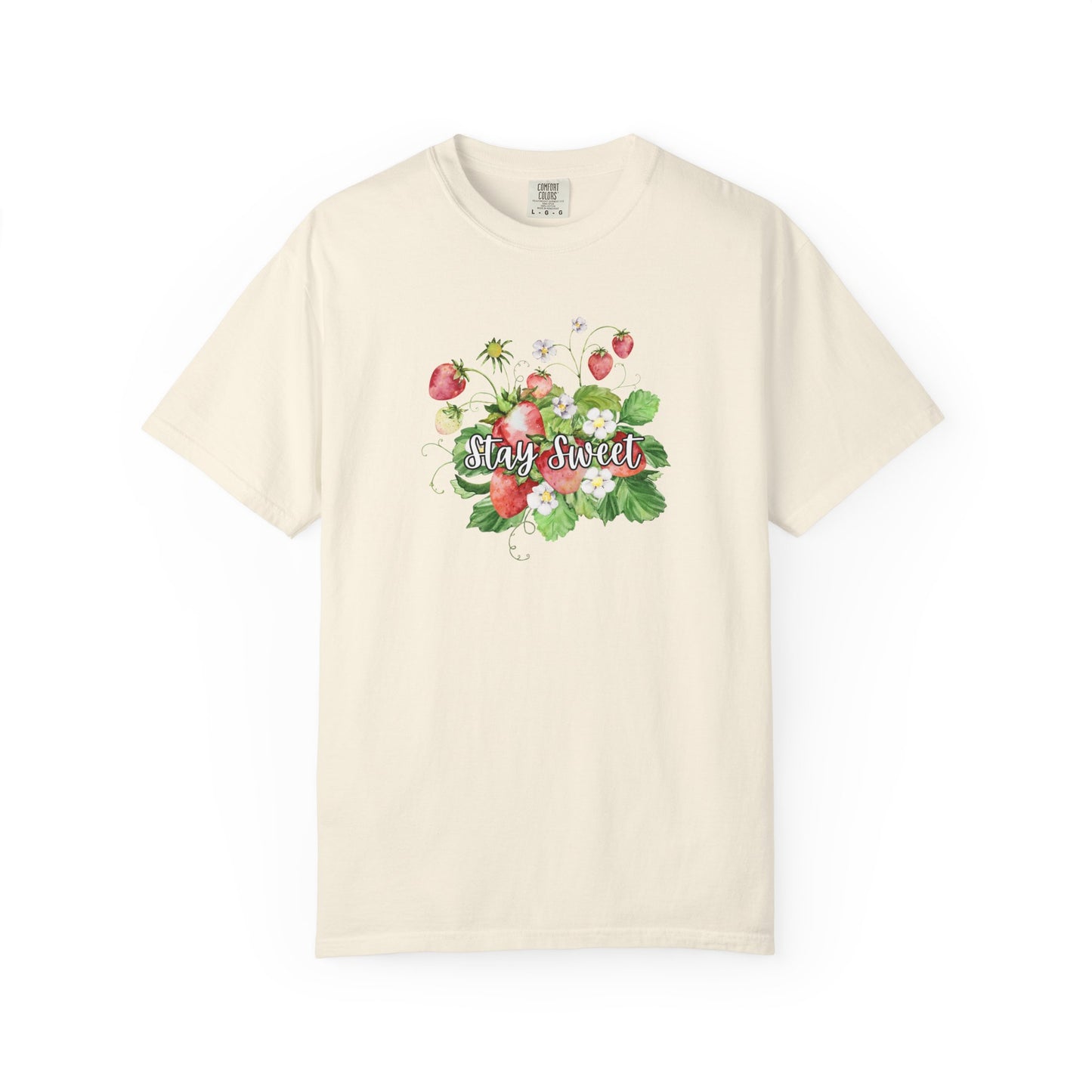 An off-white short-sleeve crewneck t-shirt featuring a watercolor-style graphic of strawberries and green leaves with the text 'Stay Sweet' across the chest, displayed on a clean white background.