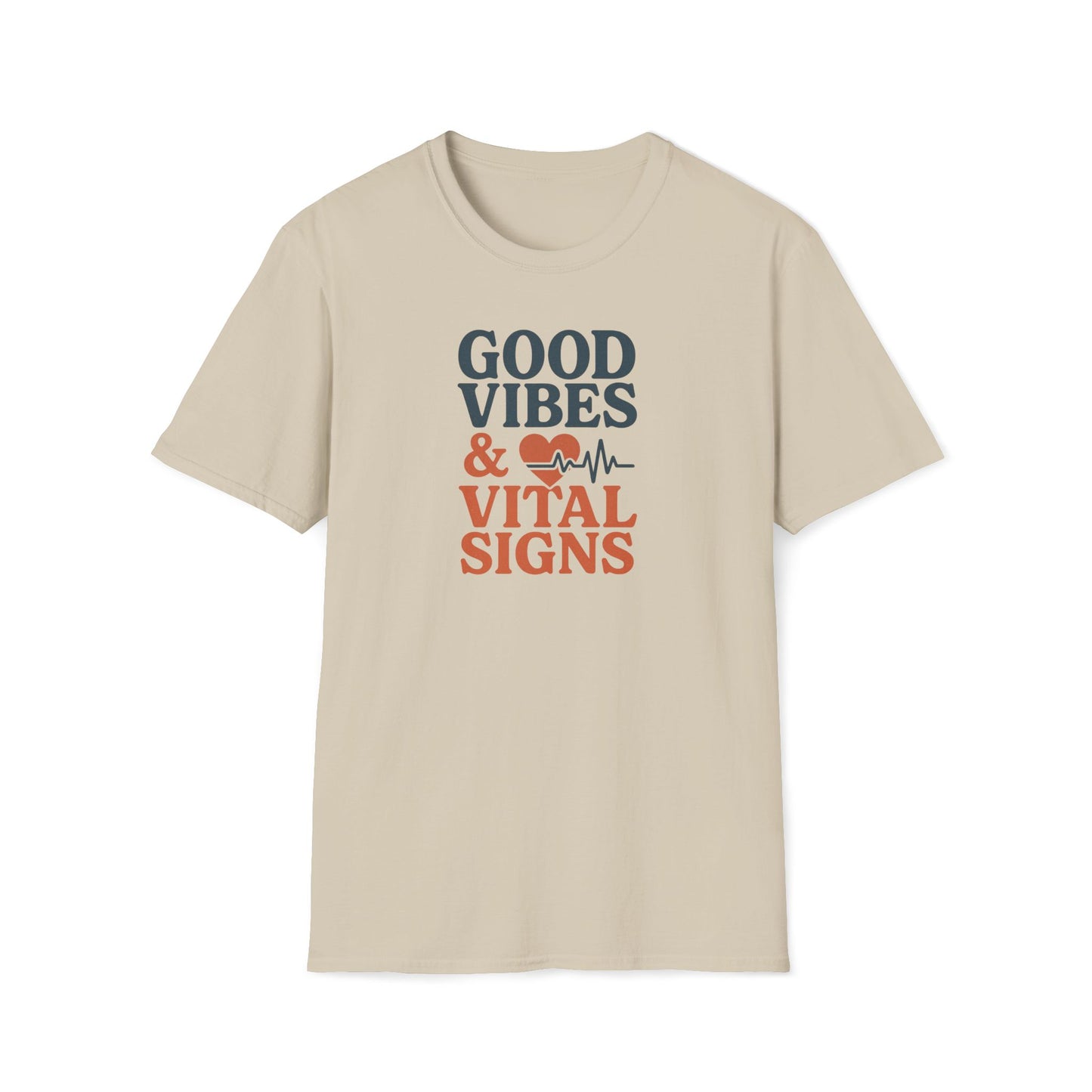 A beige short-sleeve crewneck t-shirt with a graphic on the chest that reads 'GOOD VIBES & VITAL SIGNS' in dark gray and orange lettering, accompanied by a small red heart and heartbeat line icon, shown on a plain white background.