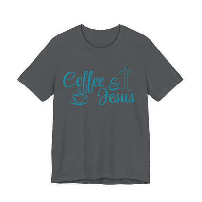 A dark gray short-sleeve crewneck t-shirt with a turquoise graphic on the chest that reads 'Coffee & Jesus' alongside a coffee cup and a cross.