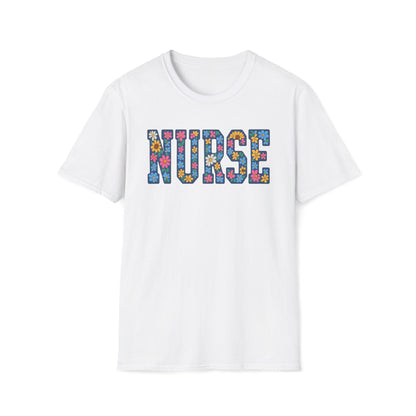 A white short-sleeve crewneck t-shirt featuring the word 'NURSE' printed across the chest in a colorful floral patterned font, set against a plain white background.
