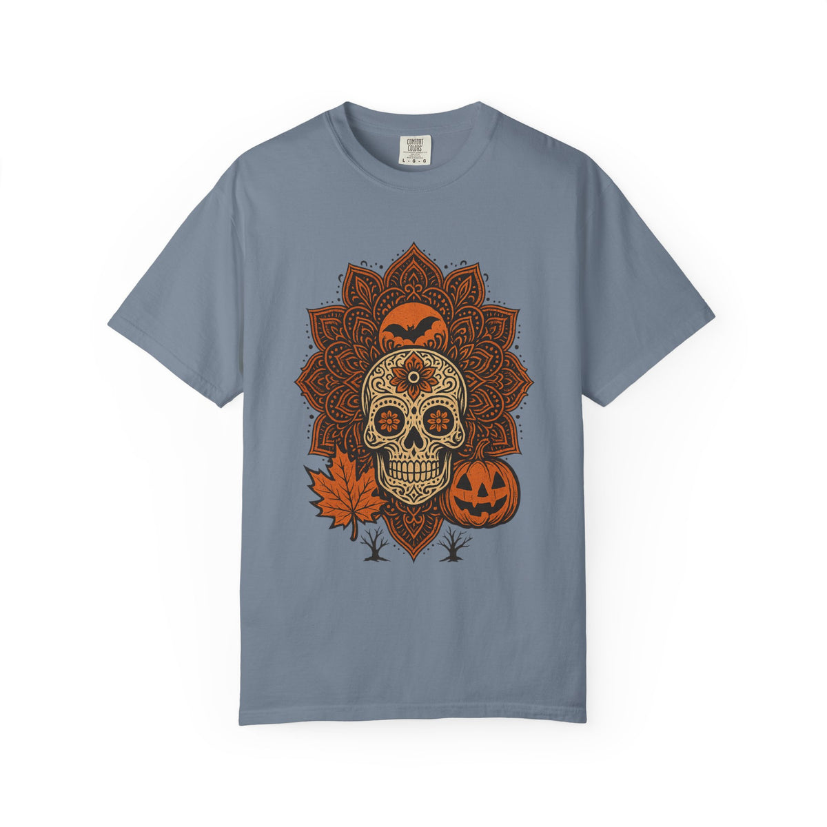 A slate blue crewneck t-shirt featuring a central Halloween graphic of a sugar skull, jack-o'-lantern, orange leaf, and mandala pattern on a white background.