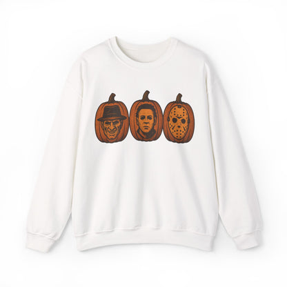 A white crewneck sweatshirt featuring a graphic print of three horror movie pumpkin pumpkins on the chest, displayed against a clean white background.