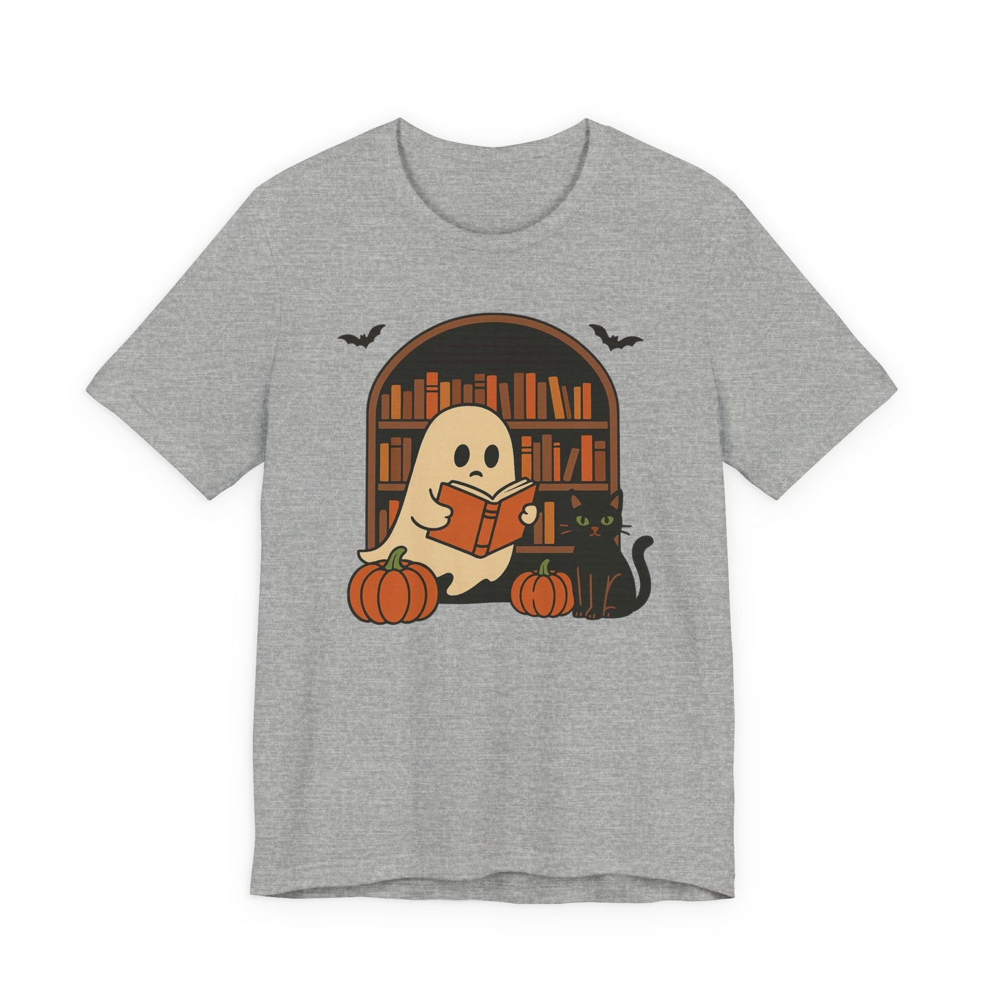 A heather gray short-sleeve t-shirt with a graphic of a cute cartoon ghost reading a book in front of a bookshelf, accompanied by pumpkins, a black cat, and bats.