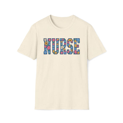 An off-white crewneck t-shirt featuring the word 'NURSE' printed across the chest in a colorful floral patterned font, displayed on a clean white background.