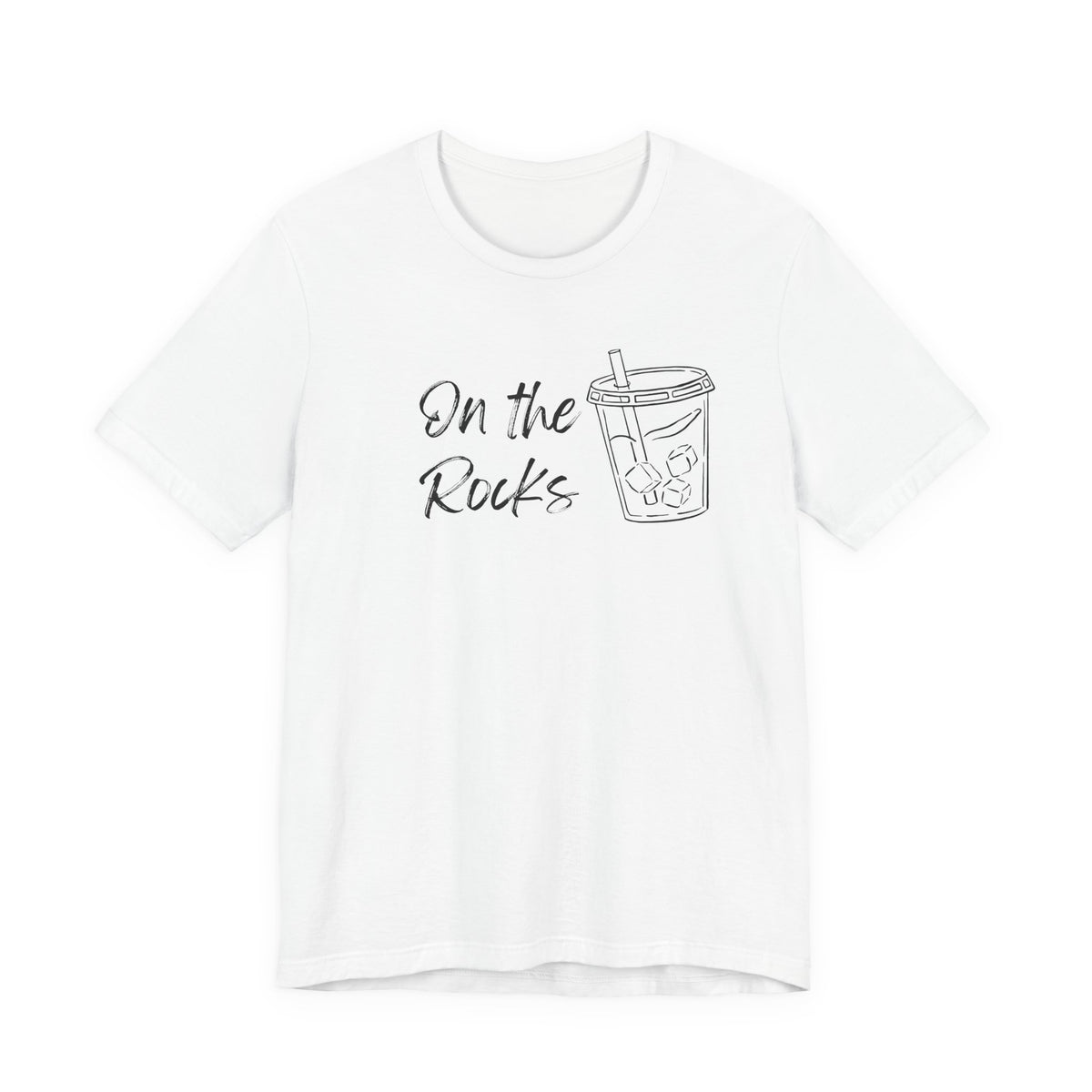 A white short-sleeve crewneck t-shirt featuring a black graphic print on the front with the text 'On the Rocks' next to a simple line drawing of a iced coffee cup.