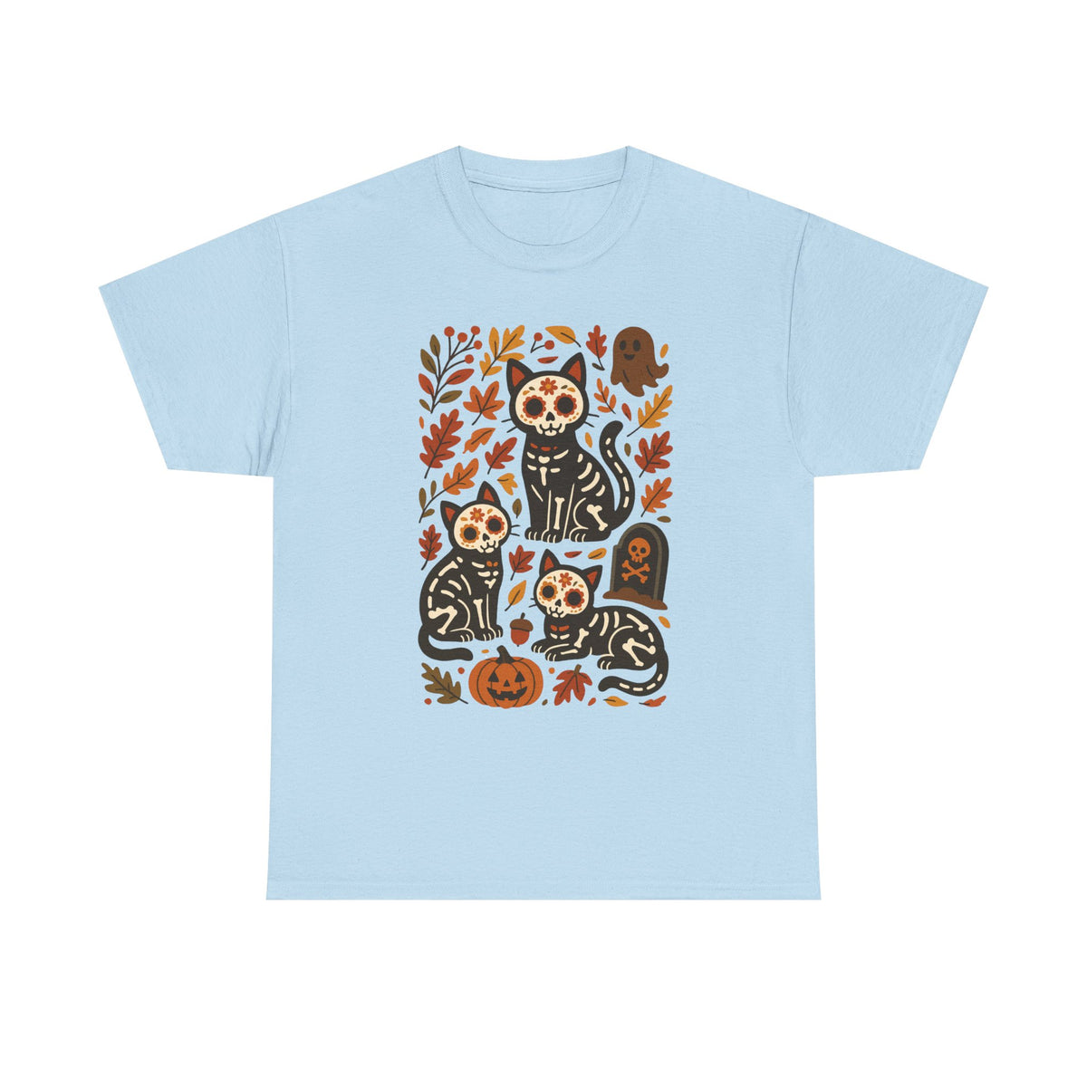 A light blue short-sleeve crewneck t-shirt featuring a central graphic print of four black cats with sugar skull makeup surrounded by autumn leaves, pumpkins, and tombstones.