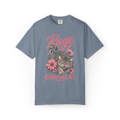 A slate blue short-sleeve t-shirt with a graphic print of a tabby cat surrounded by pink flowers and the text 'Rage CONSUMES ME' in pink, displayed on a clean white background.
