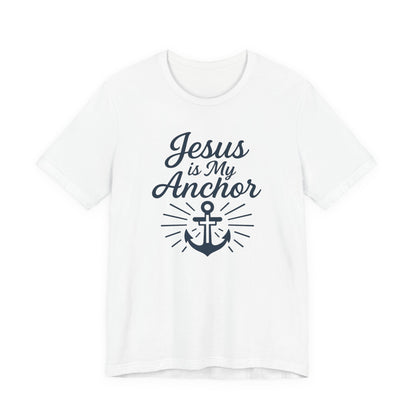 A white short-sleeve crewneck t-shirt featuring a navy blue graphic print on the front that reads 'Jesus is My Anchor' above an anchor illustration with radiating lines.
