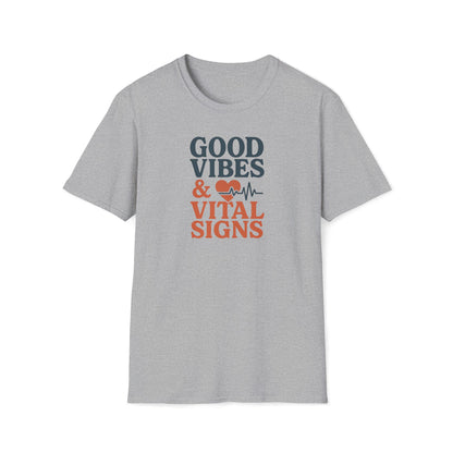 A light heather gray short-sleeve t-shirt with a graphic on the chest that reads 'GOOD VIBES & VITAL SIGNS' in dark blue and orange text, accompanied by a heart and heartbeat line icon.