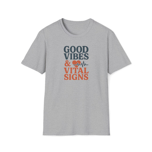 A light heather gray short-sleeve t-shirt with a graphic on the chest that reads 'GOOD VIBES & VITAL SIGNS' in dark blue and orange text, accompanied by a heart and heartbeat line icon.