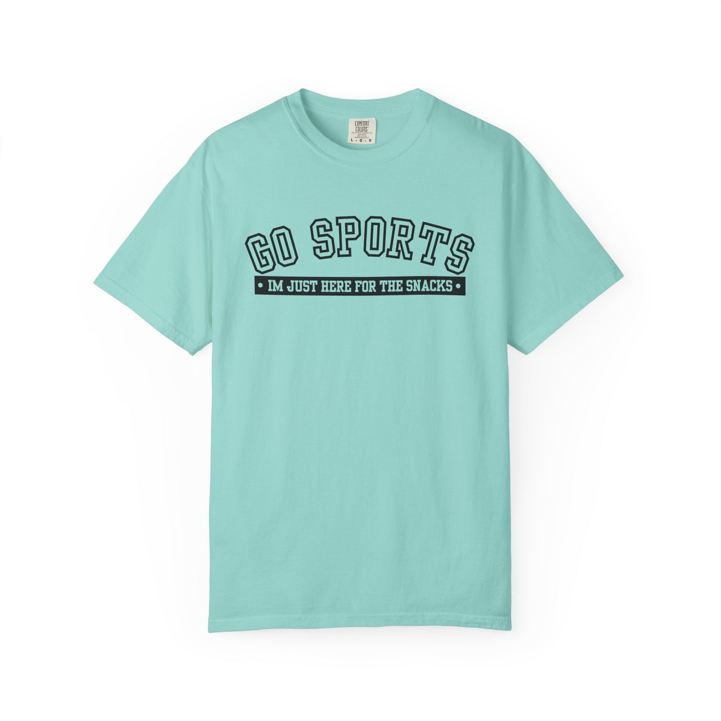 A light mint green short-sleeve t-shirt with a black graphic on the chest that reads 'GO SPORTS' and 'I'M JUST HERE FOR THE SNACKS'.