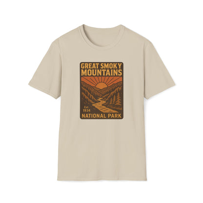 A light beige crewneck t-shirt featuring a retro-style graphic print of the Great Smoky Mountains National Park on the chest, displayed against a solid white background.