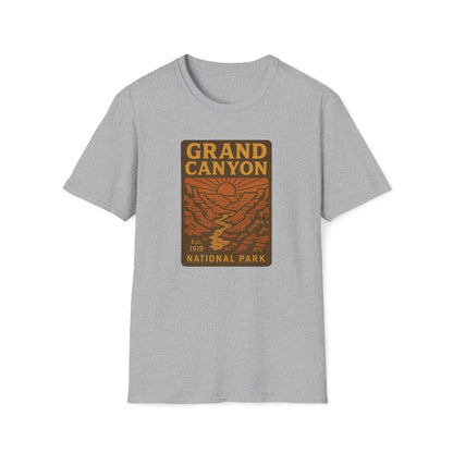 A light heather gray short-sleeve crewneck t-shirt featuring a vintage-style orange and brown 'Grand Canyon National Park' graphic printed on the chest, displayed against a solid white background.