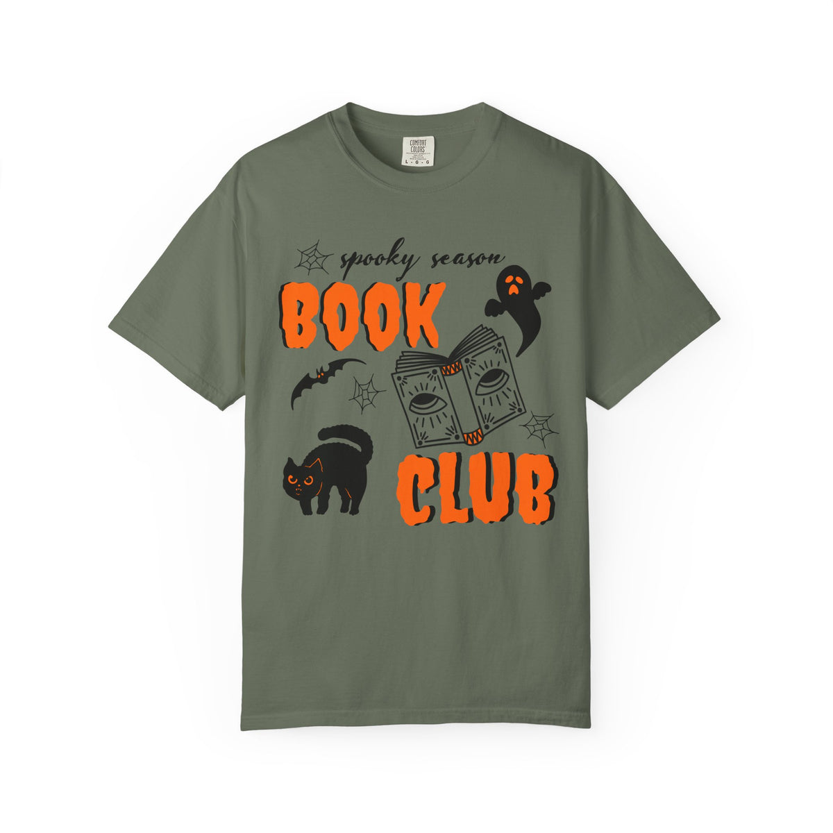 An olive green short-sleeve t-shirt with a Halloween-themed graphic print featuring the text 'spooky season BOOK CLUB' in orange, along with illustrations of a black cat, ghost, bat, and an open book.