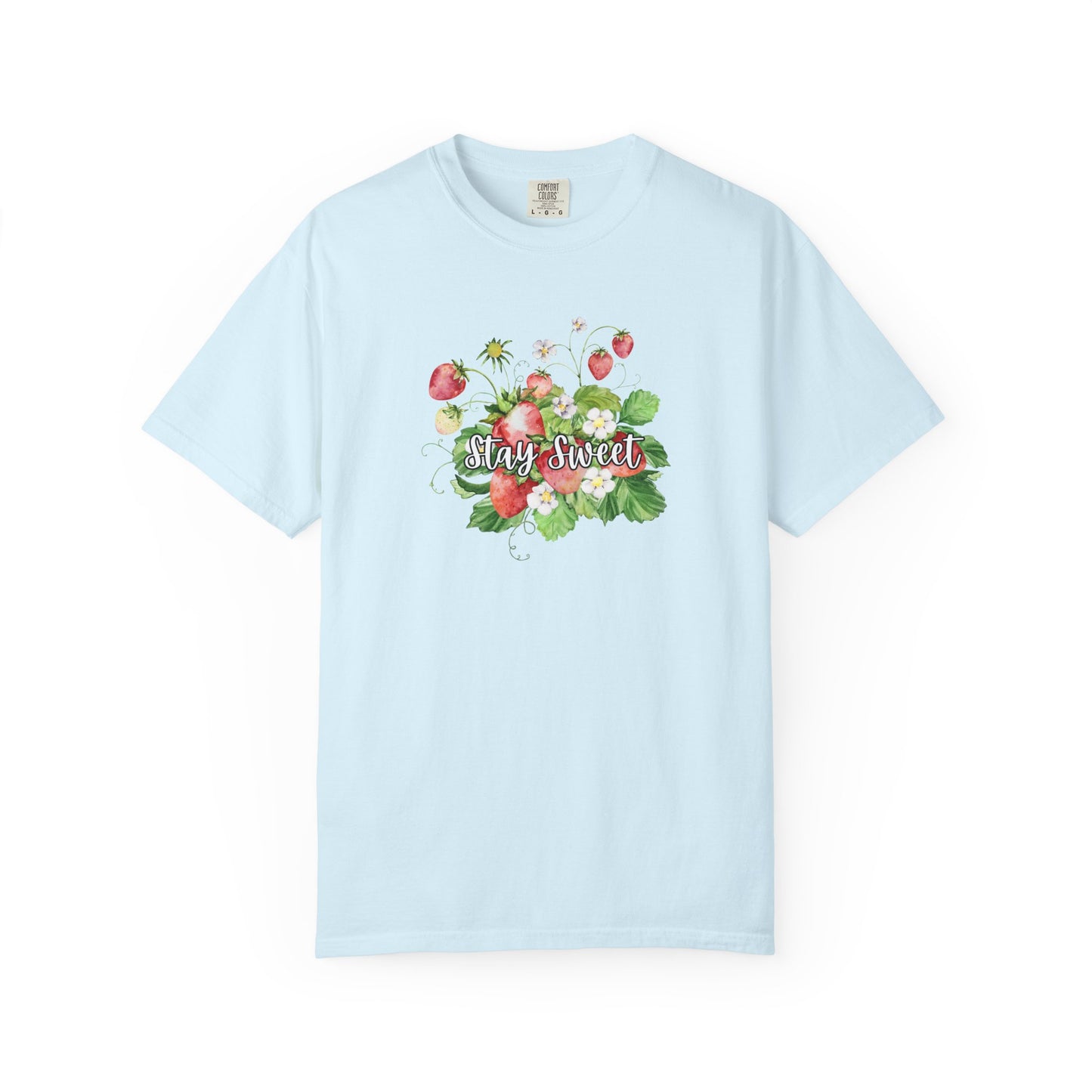 A light blue short-sleeve crewneck t-shirt featuring a colorful watercolor graphic of strawberries, green leaves, and the words 'Stay Sweet' in cursive across the chest.