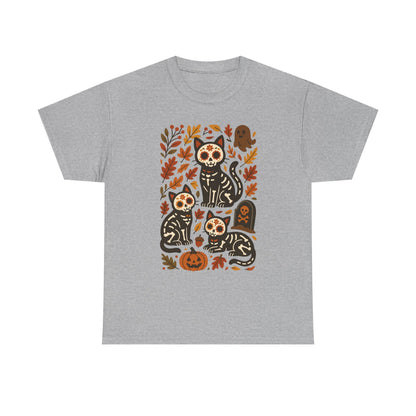A heather gray short-sleeve crewneck t-shirt featuring a colorful graphic print of three black cats with sugar skull designs surrounded by autumn leaves, pumpkins, and tombstones.