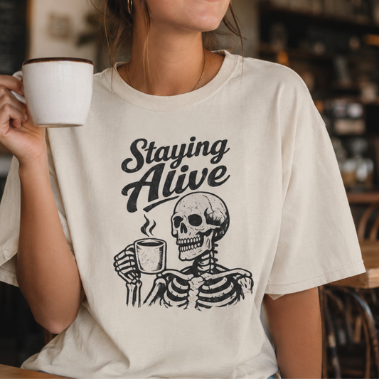 Staying Alive Skeleton Coffee T-Shirt | Skull with Mug Tee